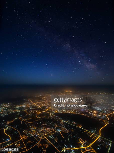galaxy and city light - airplane lights stock pictures, royalty-free photos & images