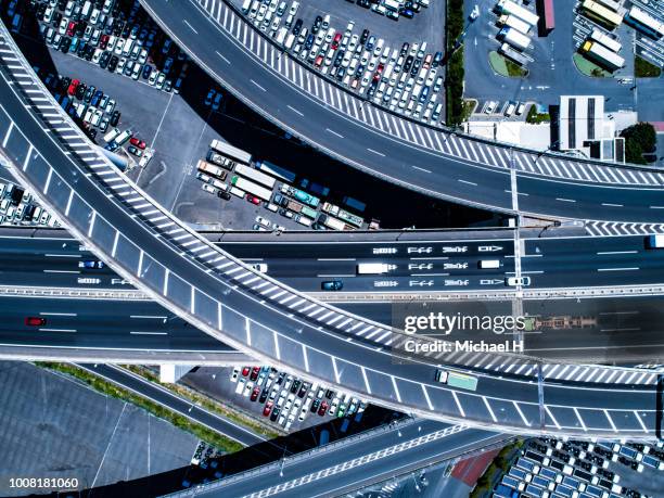 aerial view of intersection and crowded car slots - multiple lane highway ストックフォトと画像