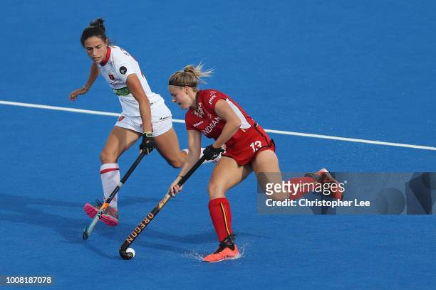 Alix Gerniers of Belgium battles with Beatriz Perez of Spain during the Cross-over game between Belgium and Spain of the FIH Womens Hockey World Cup...