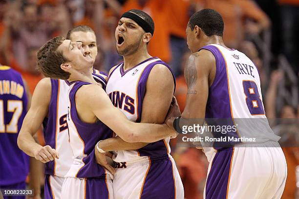 Goran Dragic, Jared Dudley and Channing Frye of the Phoenix Suns react to a play against the Los Angeles Lakers in the second quarter of Game Four of...