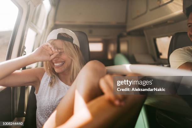 young couple taking a ride by van - mini van driving stock pictures, royalty-free photos & images