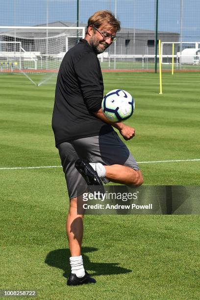 Jurgen Klopp manager of Liverpool playing football a training session on July 31, 2018 in Evian-les-Bains, France.