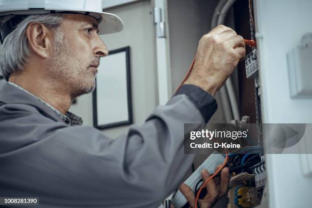 Electrician High Rises Electrician High-Res Stock Photo - Getty Images