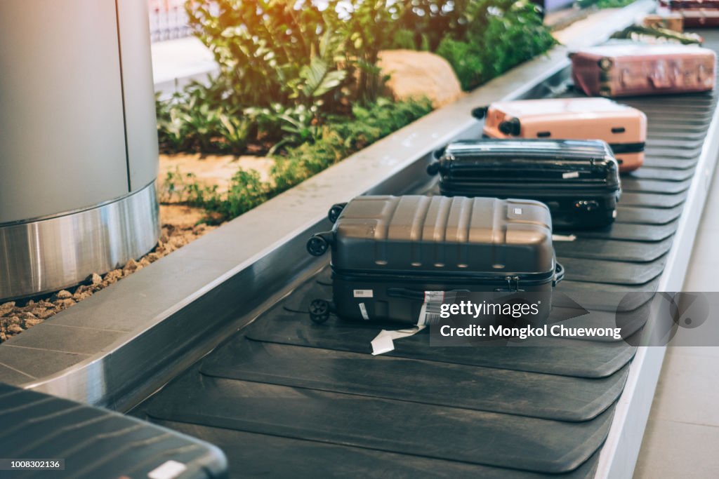 Suitcase or luggage with conveyor belt in the international airport.