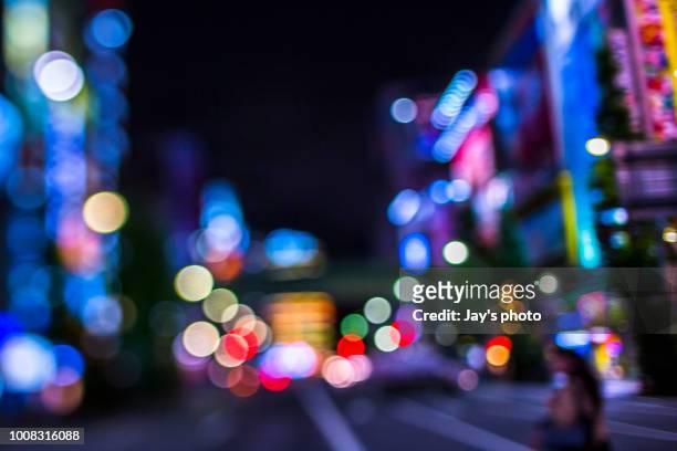 defocused lights of cityscape bokeh - citylight stockfoto's en -beelden