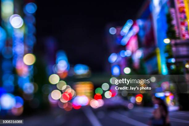 defocused lights of cityscape bokeh - bokeh light stock pictures, royalty-free photos & images