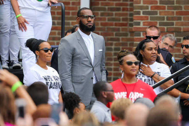 LeBron James arrives with his wife Savannah James and Gloria James for the grand opening of the I Promise school on July 30, 2018 in Akron, Ohio. The...