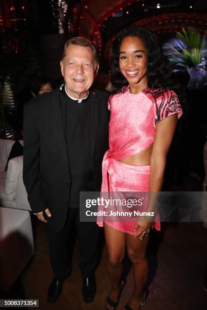 Father Michael Pfleger and Laura Harrier attend the "BlacKkKlansman" New York Premiere at Brooklyn Academy of Music on July 30, 2018 in New York City.