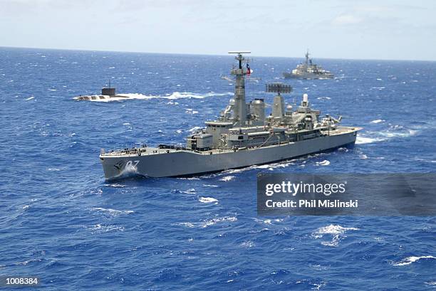 Naval ships from multiple nations steam in formation during the RIMPAC excercise operations July 11, 2002 near Oahu, Hawaii. U.S. Naval forces and...