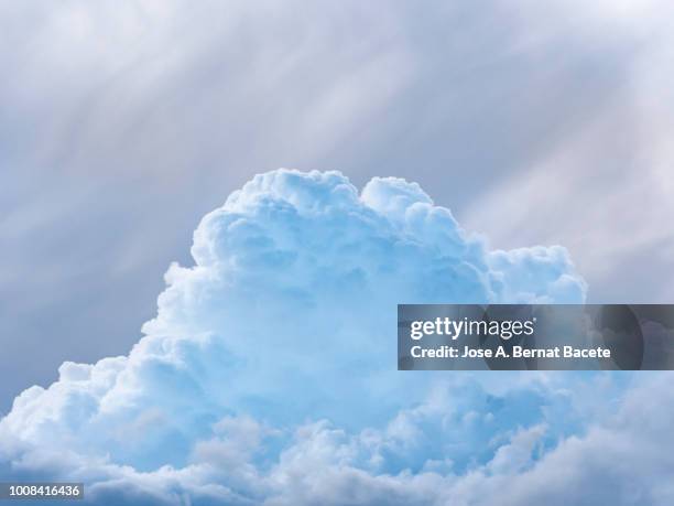 full frame of blue sky and white clouds of storm, cumulonimbus. - high noon stock-fotos und bilder