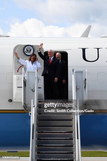 Vice President of the United States Michael Pence and his wife, Karen Pence, second lady of the United States, egress the C-32 Air Force Two, on...