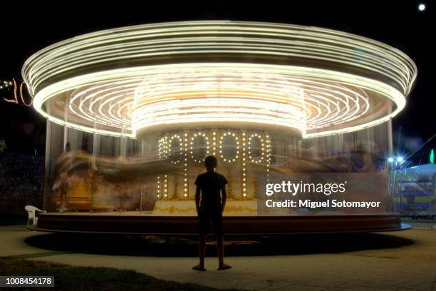 one night at the amusement park - carousel foto e immagini stock