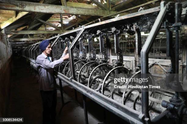 Worker seen inside a 100 year old closed filature of a silk factory at Solina on July 19, 2018 in uptown area of Srinagar, India. Since 1989, the...