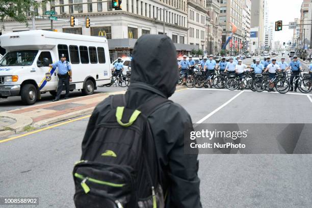 After the city issued an eviction notice Sanitation department workers clean up remainders of what started as an Abolish ICE protest camp, near City...