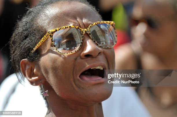 After the city issued an eviction notice Sanitation department workers clean up remainders of what started as an Abolish ICE protest camp, near City...