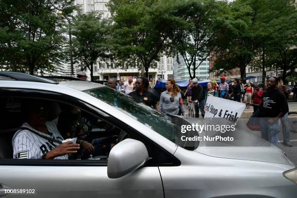 After the city issued an eviction notice Sanitation department workers clean up remainders of what started as an Abolish ICE protest camp, near City...