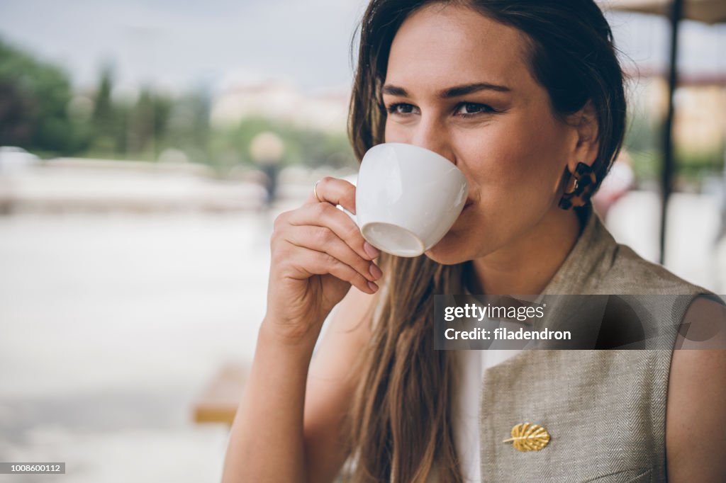 Woman drinking coffee outdoor
