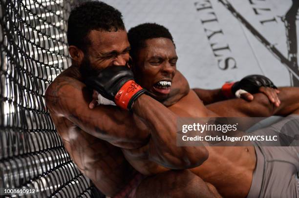 Jordan Griffin secures a rear choke submission against Maurice Mitchell in their featherweight fight during Dana White's Tuesday Night Contender...