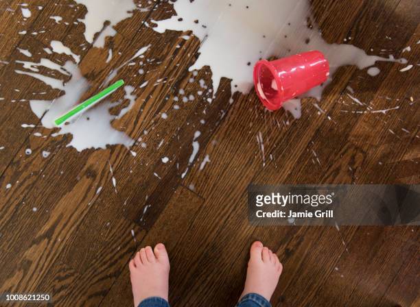 boy's feet by spilt milkshake - tantrum stock pictures, royalty-free photos & images