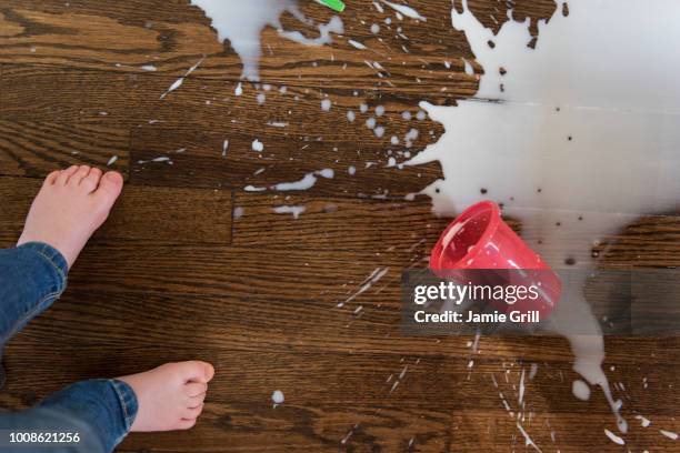 boy's feet by spilt milkshake - spilled drink stock pictures, royalty-free photos & images
