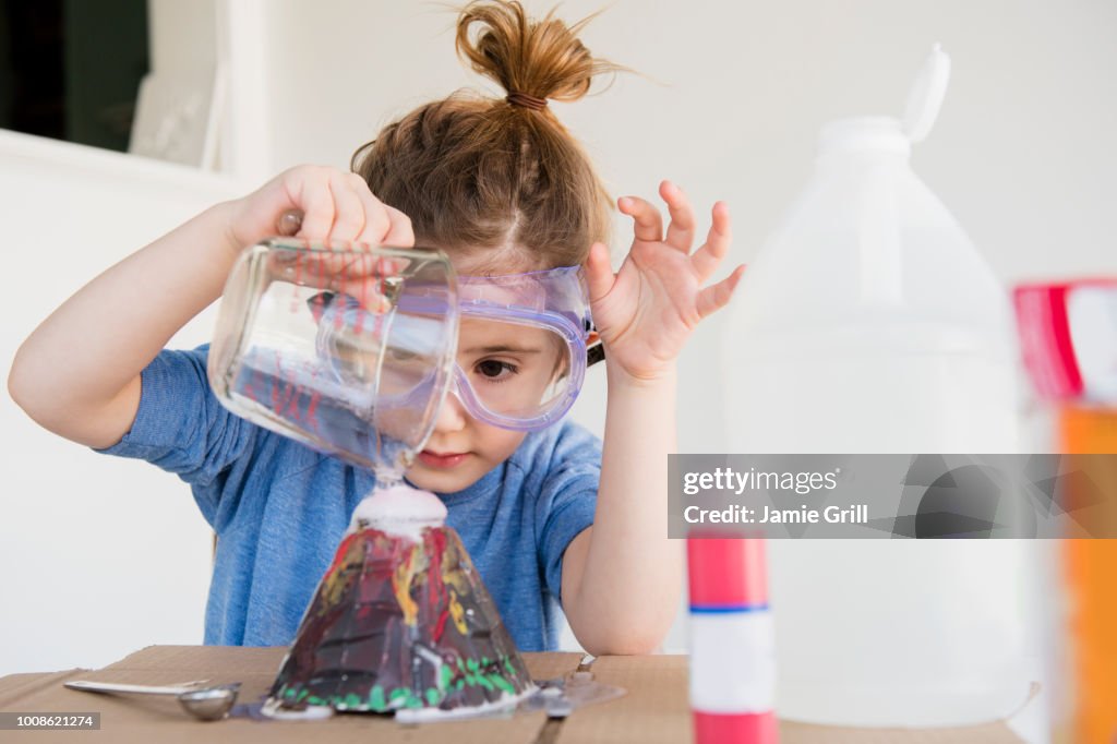Girl making volcano