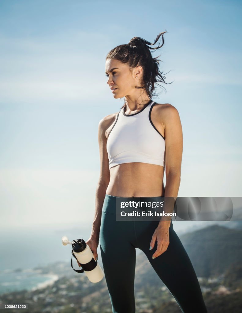 Woman in sportswear with water bottle