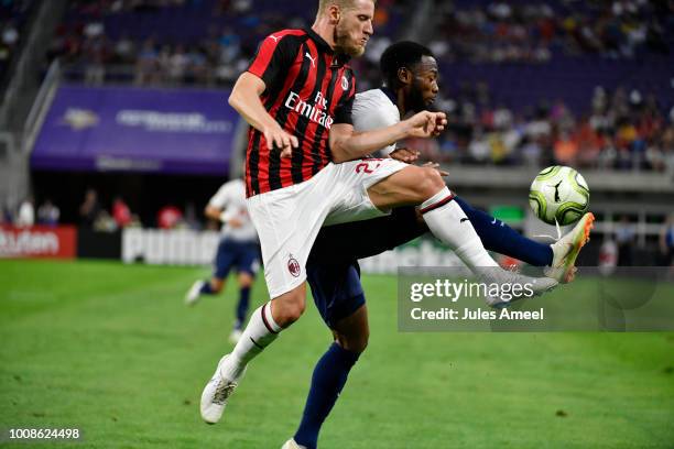Ignazio Abate of AC Milan and Georges-Kévin N'Koudou of the Tottenham Hotspur vie for the ball during the first half of the International Champions...