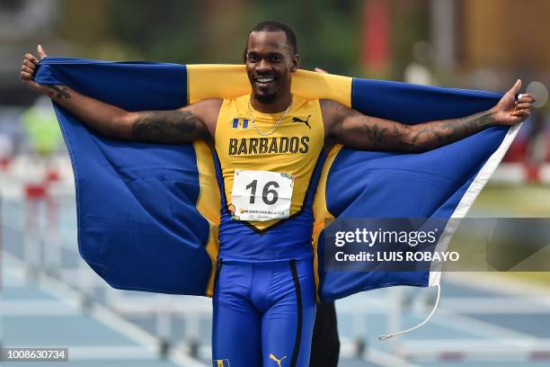 Barbados' Shane Rashad Brathwaite celebrates after winning the Men's Athletics 110M Hurdles final race during the 2018 Central American and Caribbean...