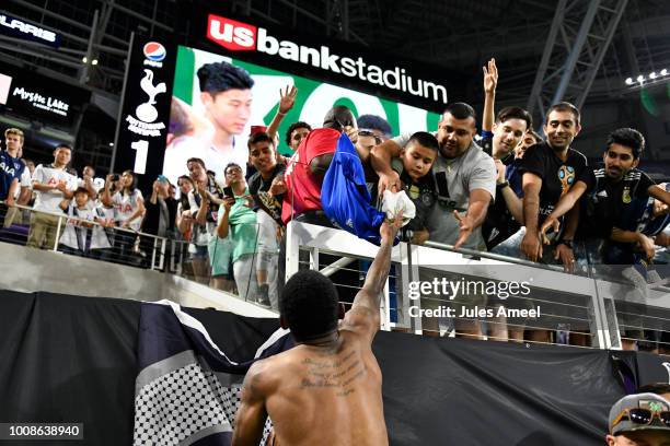 Georges-Kévin N'Koudou of the Tottenham Hotspur tosses his jersey to a fan after defeating AC Milan during a International Champions Cup 2018 match...
