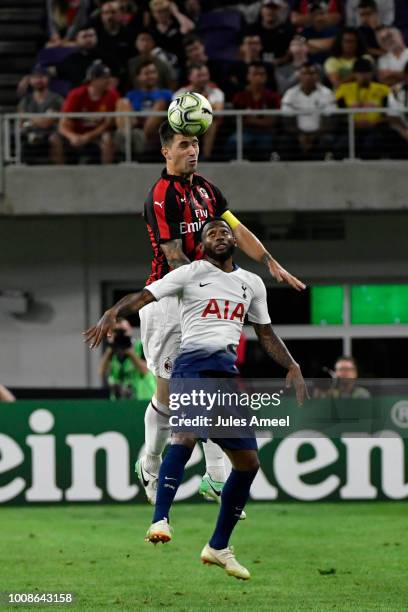 Alessio Romagnoli of AC Milan goes for a head ball in front of Georges-Kévin N'Koudou of the Tottenham Hotspur during the second half of the...