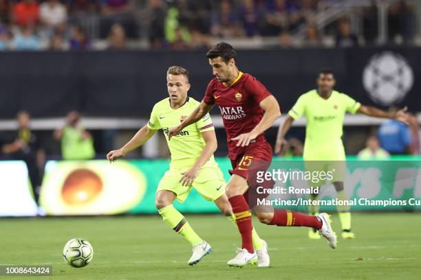 Ivan Marcano of AS Roma and Arthur Melo of FC Barcelona vie for posession during their International Champions Cup 2018 match at AT&T Stadium on July...