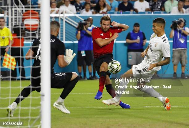 Juan Mata of Manchester United shoots on goal past Javi Sanchez of Real Madrid during the International Champions Cup 2018 match between Manchester...