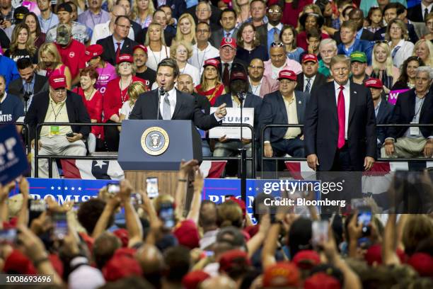 Representative Ron DeSantis, a Republican from Florida, center left, addresses the crowd as U.S. President Donald Trump, right, smiles onstage during...