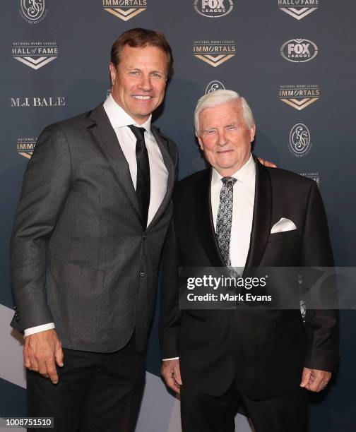 Andrew Ettingshausen and his father John pose for photos as they arrive at the 2018 NRL Hall of Fame at Sydney Cricket Ground on August 1, 2018 in...