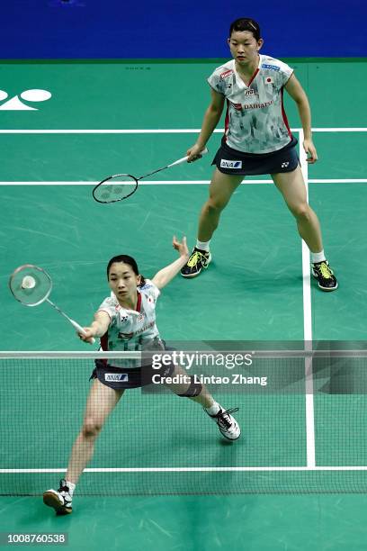 Misaki Matsutomo and Ayaka Takahashi of Japan compete against Woon Khe Wei and Vivian Hoo of Malaysia in their Women's doubles match during the day...