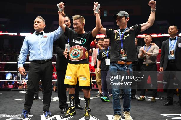 Japanese boxer Sho Kimura celebrates after defeating Filipino challenger Froilan Saludar during WBO Flyweight Title Bout at Qingdao Guosen Gymnasium...