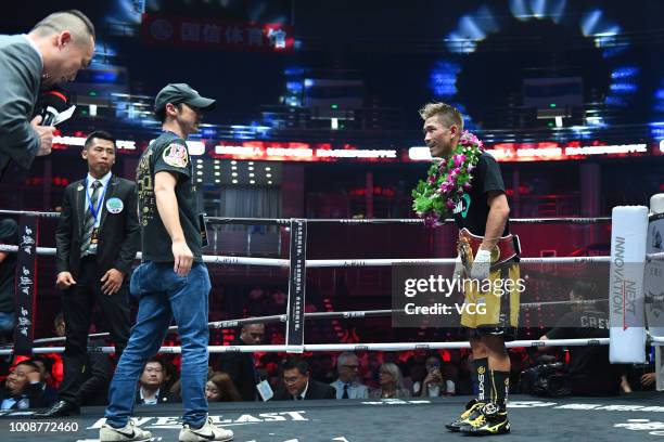 Japanese boxer Sho Kimura celebrates after defeating Filipino challenger Froilan Saludar during WBO Flyweight Title Bout at Qingdao Guosen Gymnasium...