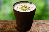 Image of a glass of lassi made from milk curd