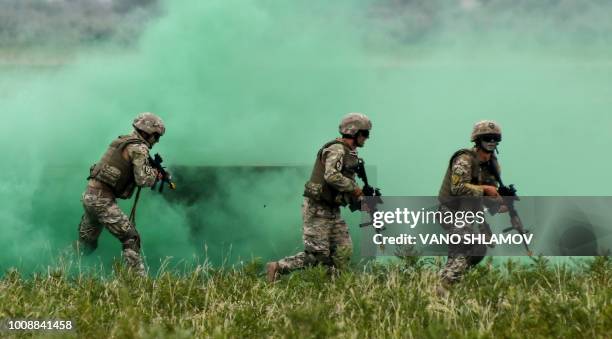 Servicemen take part in the joint multinational military exercise "Noble Partner 2018" at Vaziani training centre, outside Tbilisi, on August 1,...