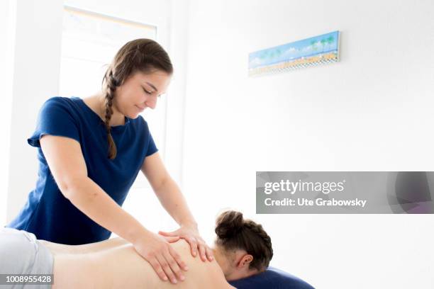 May 25: Physiotherapist and patient undergoing treatment in a physiotherapy practice on May 25, 2018 in BONN, GERMANY.