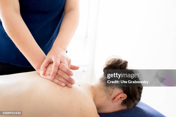 May 25: Physiotherapist and patient undergoing treatment in a physiotherapy practice on May 25, 2018 in BONN, GERMANY.