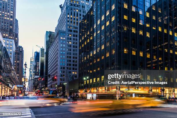 long exposure of nyc manhattan street - yellow taxi stockfoto's en -beelden