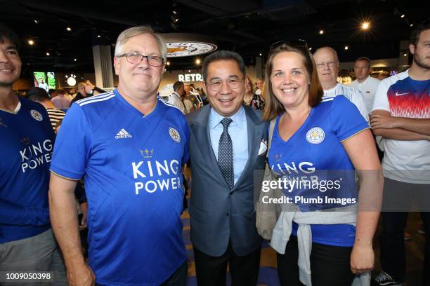 Chairman Vichai Srivaddhanaprabha of Leicester City poses with fans in the club fanstore ahead of the friendly match between Leicester City and...