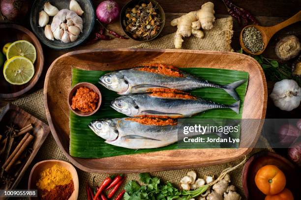 raw mackerel marinate with chili - fish banana leaf stock pictures, royalty-free photos & images