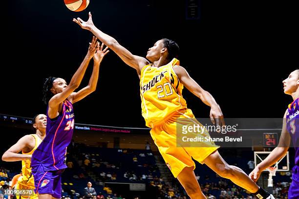 Marion Jones of the Tulsa Shock reaches for a rebound during the WNBA game on May 25, 2010 at the BOK Center in Tulsa, Oklahoma. NOTE TO USER: User...