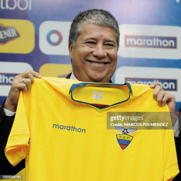 Colombian Hernan Dario "El Bolillo" Gomez poses with Ecuador's national team jersey, during a press conference at the Ecuadoran Football Federation...