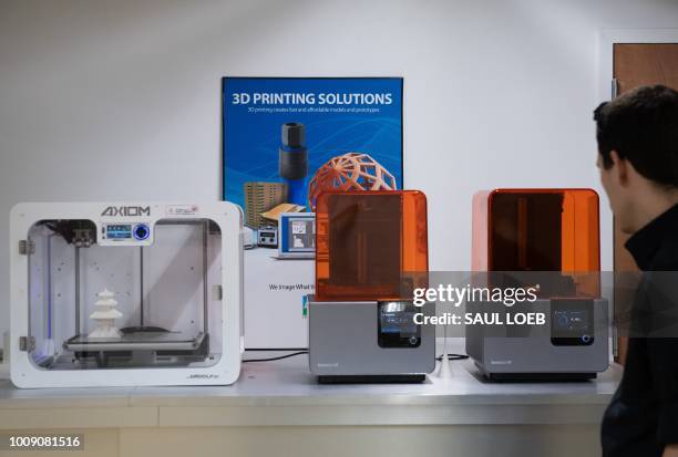 Different types of 3D-printers are seen at ABC Imaging in Washington, DC, on August 1, 2018. - A US judge on July 31, 2018 temporarily blocked the...