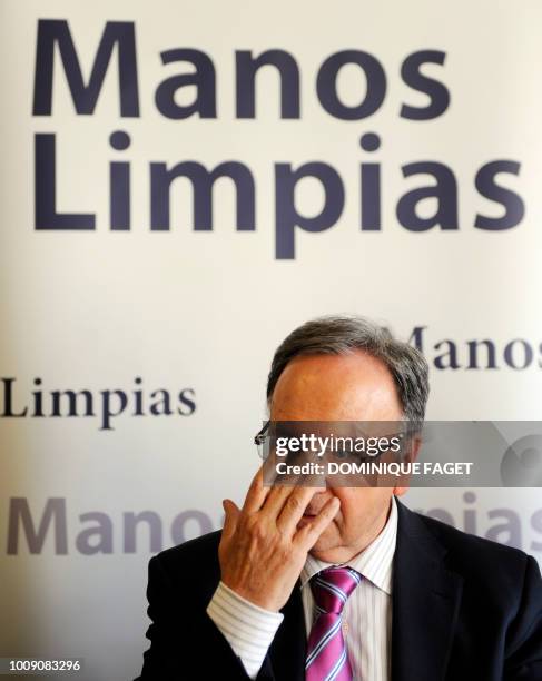 Miguel Bernad, Secretary General of the Union of Officials "Manos Limpias" delivers a press conference in Madrid on April 07 after the Spanish judge...