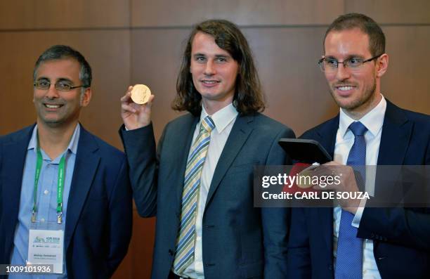 Indian Australian mathematician, Akshay Venkatesh, German mathematician Peter Scholze, and Italian mathematician Alessio Figalli, three of four...