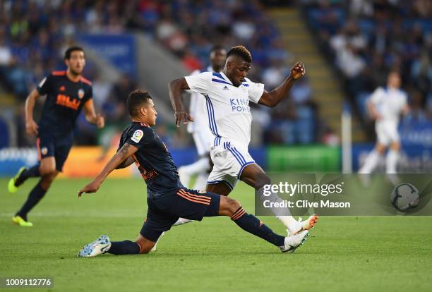 Kelechi Iheanacho of Leiceter City is challenged by Jeison Murillo of Valencia during the pre-season friendly match between Leicester City and...